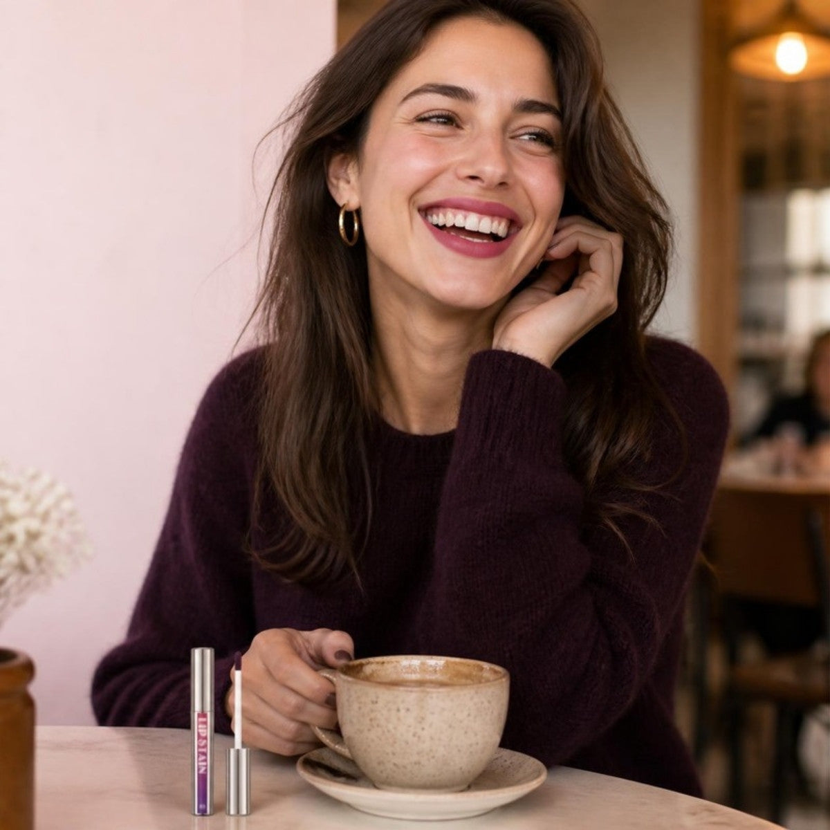 Woman with rosy stained lips at a cafe